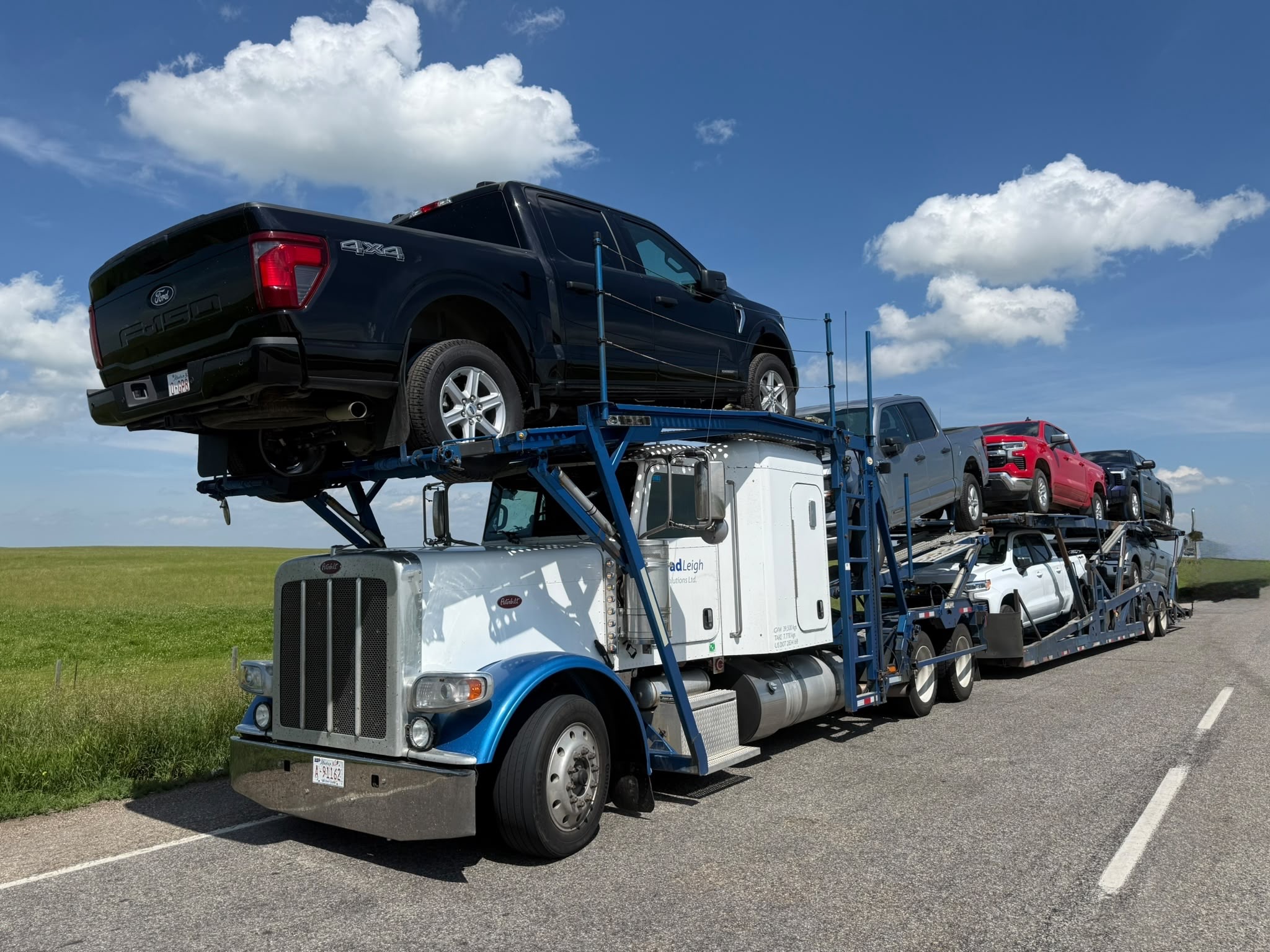 BradLeigh Solutions loaded car hauler ready for cross-border transport